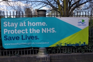 Stay at Home Protect the NHS sign, near Canary Wharf, London