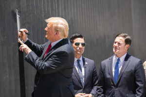 President Donald J. Trump signs a plaque Tuesday, June 23, 2020, commemorating the 200th mile of new border wall along the U.S.-Mexico border.