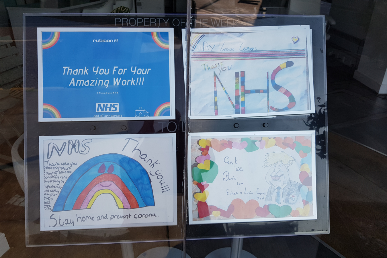 Rubicon Estate Agents window in Docklands, London with NHS drawings
