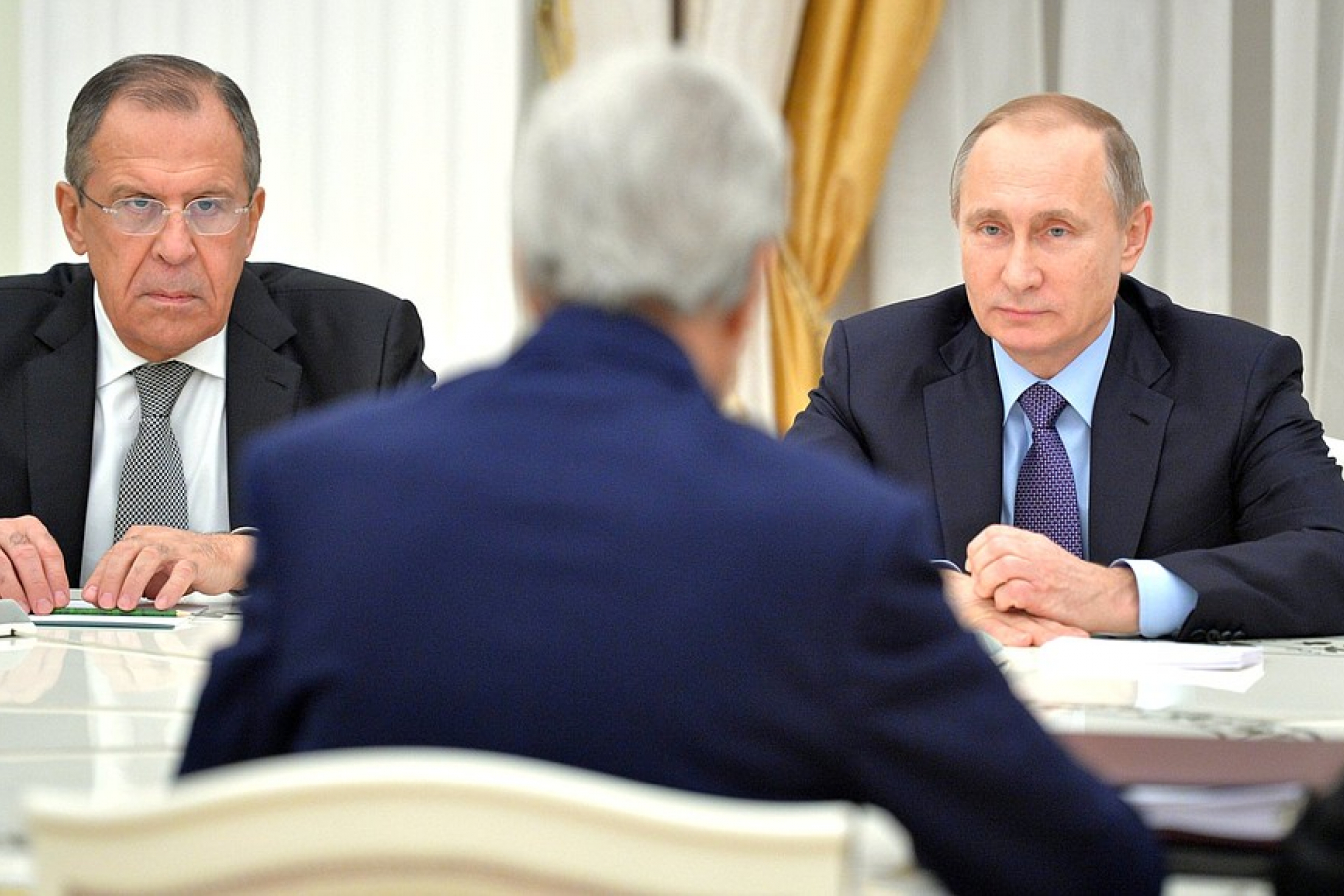 Russian Foreign Minister Sergei Lavrov and Russian President Vladimir Putin meeting former US Secretary of State John Kerry 